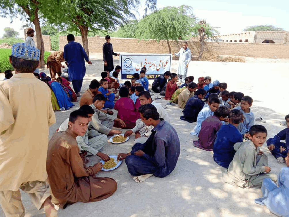 Low-income families sharing a donated meal.