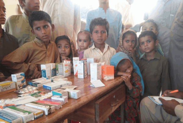 Poor kids receiving aid from an emergency relief donation.