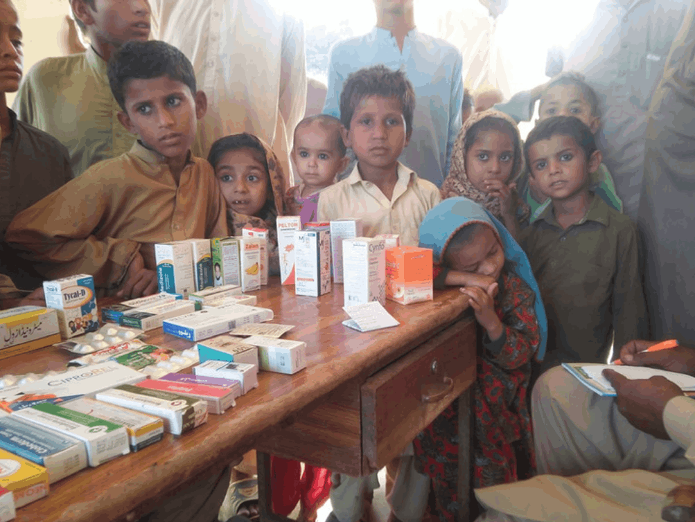 Poor kids receiving aid from an emergency relief donation.