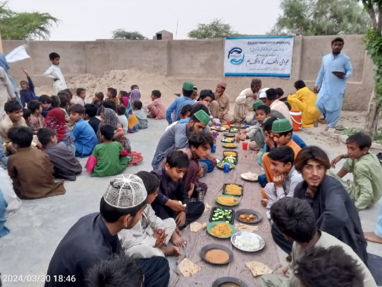Poor community sharing iftar in Ramadan.