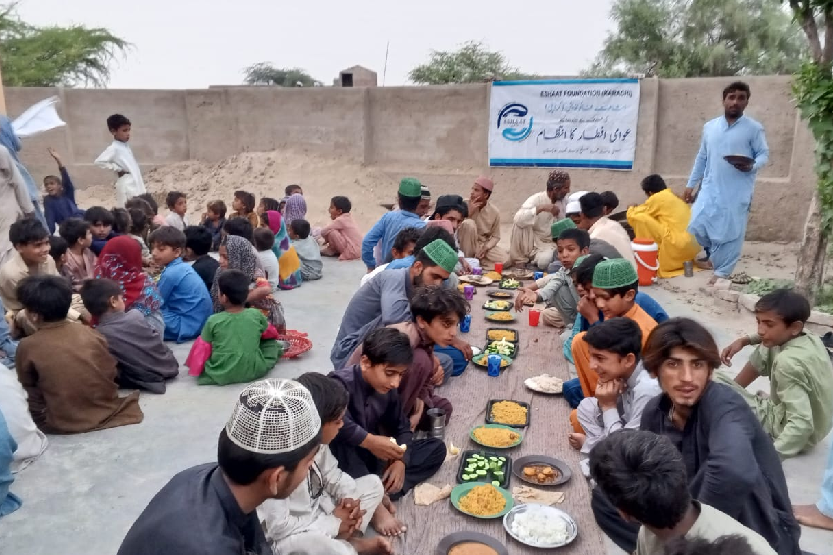 Poor community sharing iftar in Ramadan.