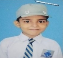Orphan boy in uniform and cap of Eshaat School.