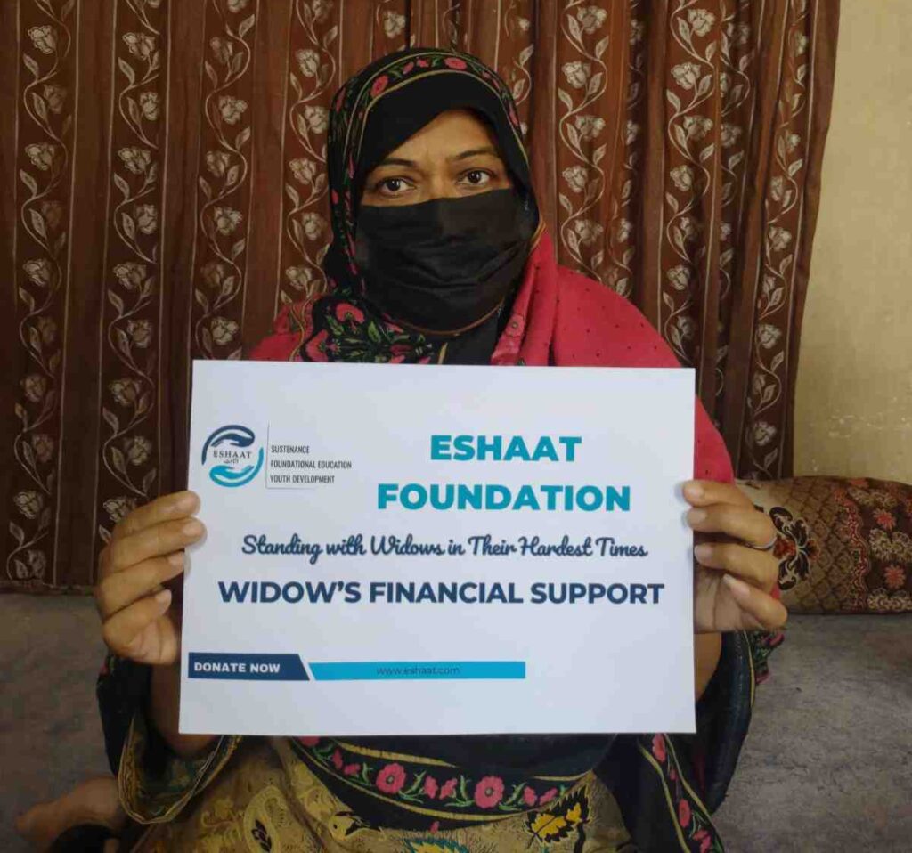 Widow holding a certificate of financial support from Eshaat Foundation