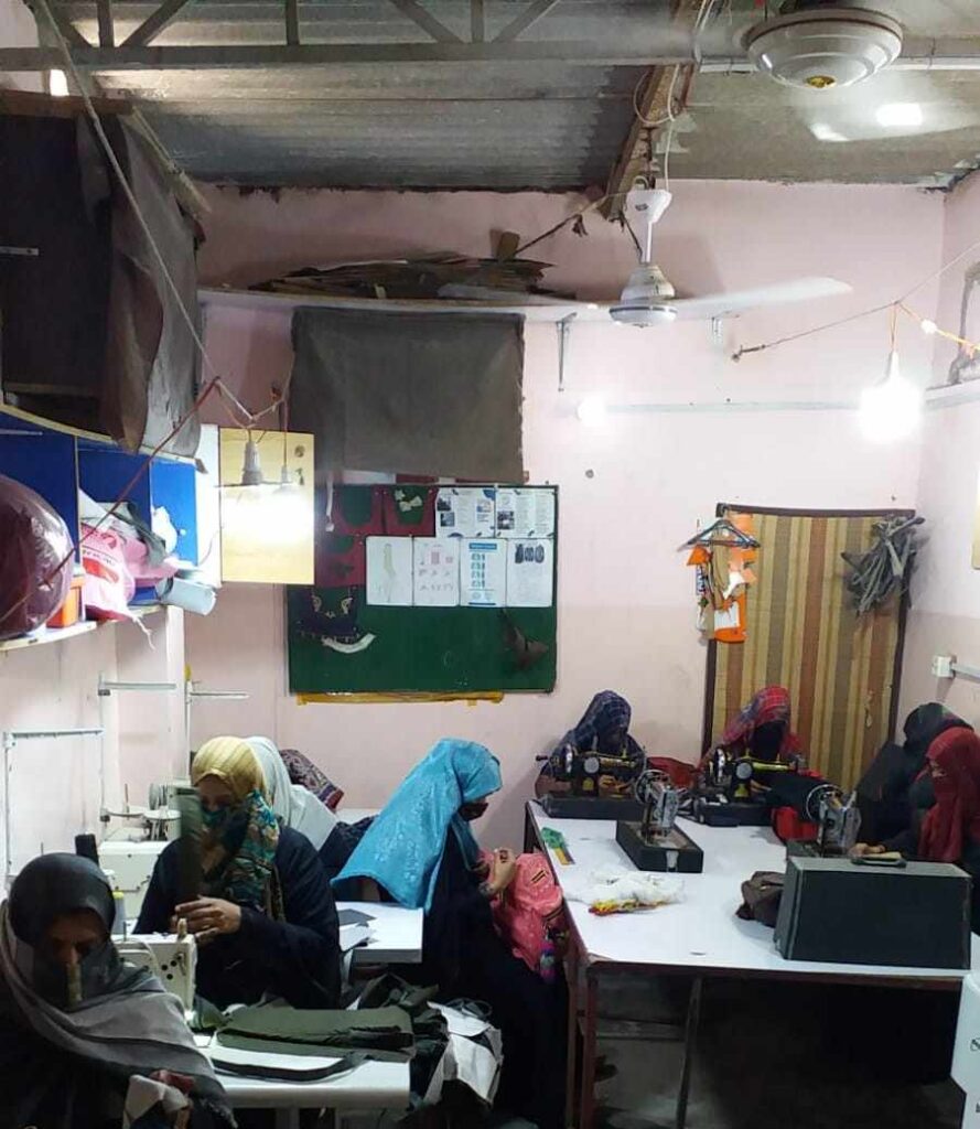 Women learning stitching in Eshaat Skill Center.